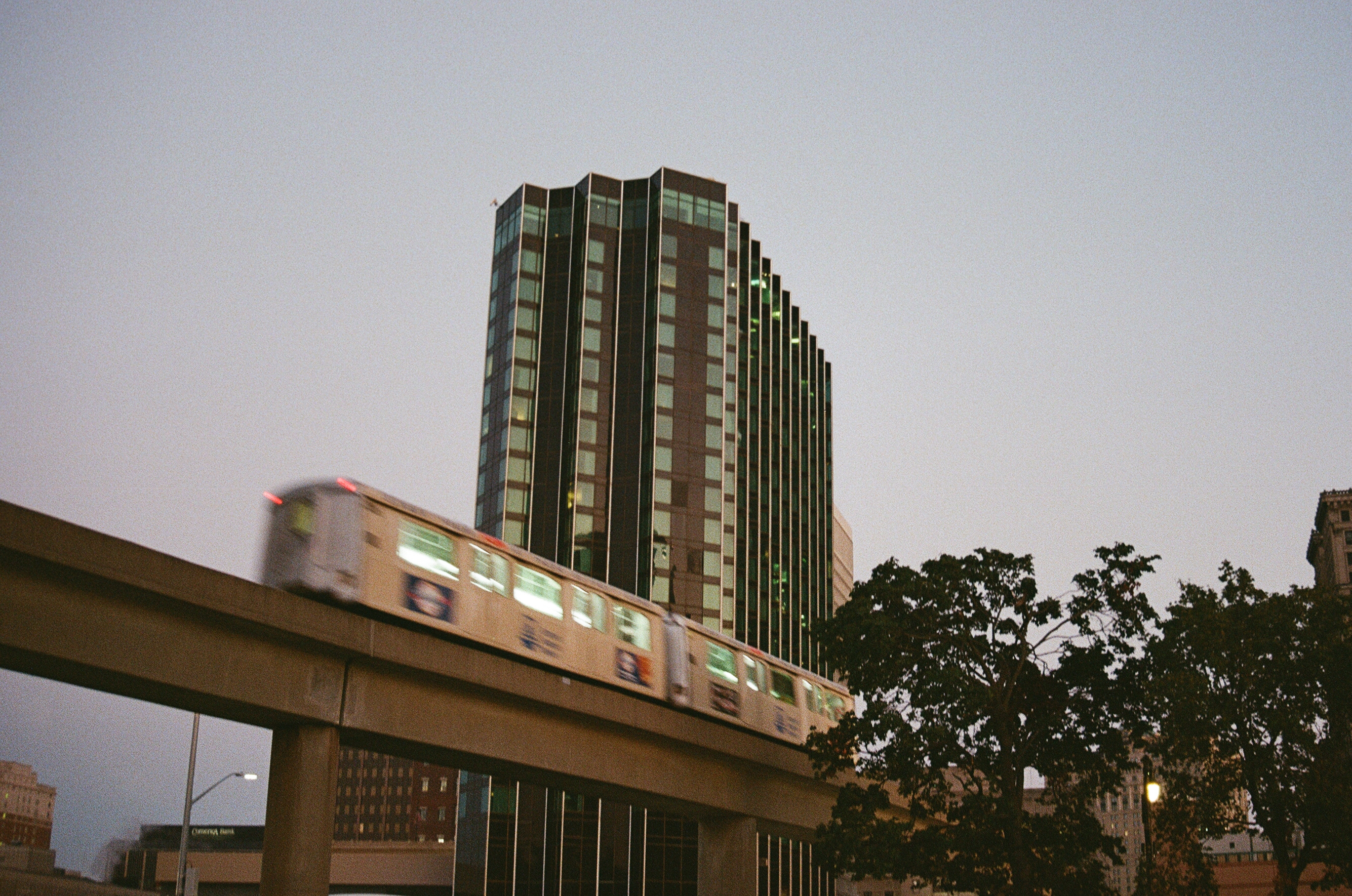 A building across the street from the conference center, with the people mover whizzing by. Canon Rebel G, EF 38-76 1:4-5.6, Fuji 400